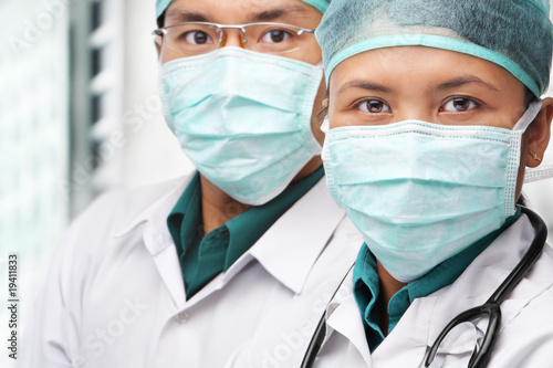 Two Asian surgeon posing to camera