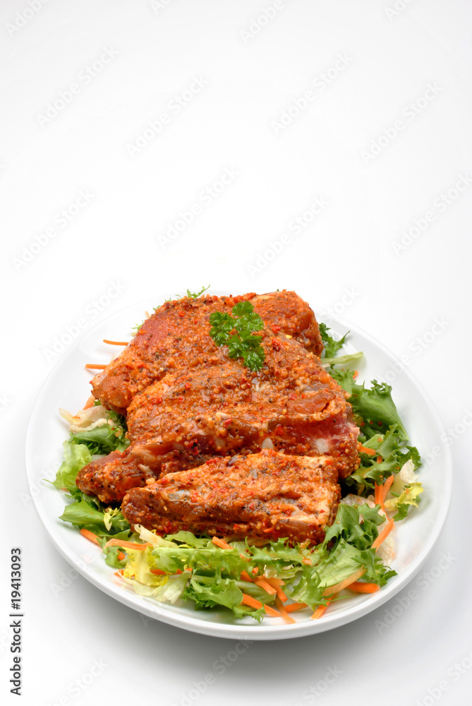 some marinated organic rib on healthy salad
