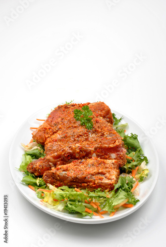 some marinated organic rib on healthy salad © Szakaly