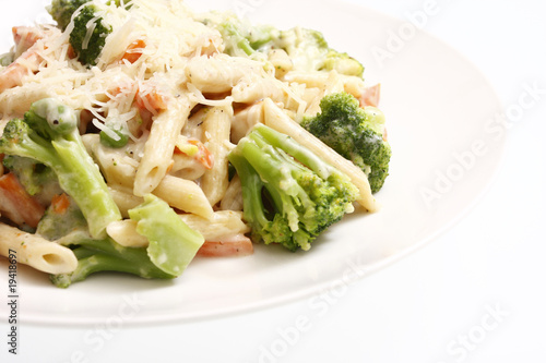 Alfredo chicken with penne pasta and vegetables.