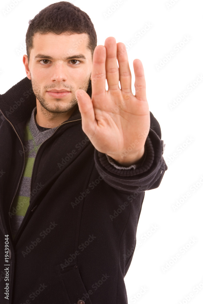portrait of young man making stop sign,isolated on white portrait of young man making stop sign,isolated on white