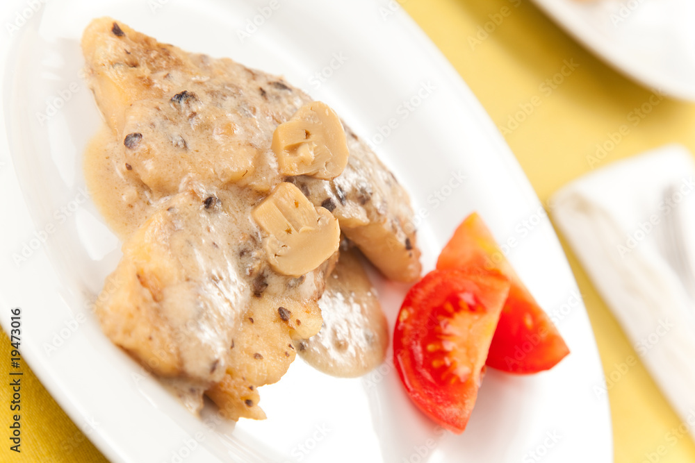 hake fillets with cheese sauce and mushrooms isolated hake fillets with cheese sauce and mushrooms isolated