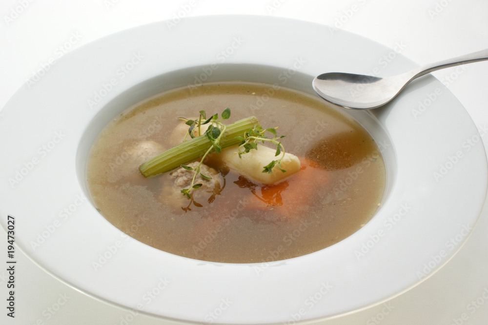 delicious vegetable soup in a white bowl with a spoon delicious vegetable soup in a white bowl with a spoon
