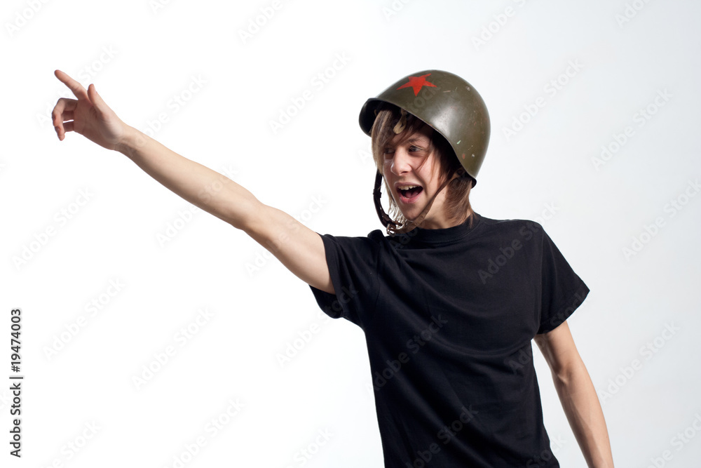 Young man in military helmet with star Young man in military helmet with star