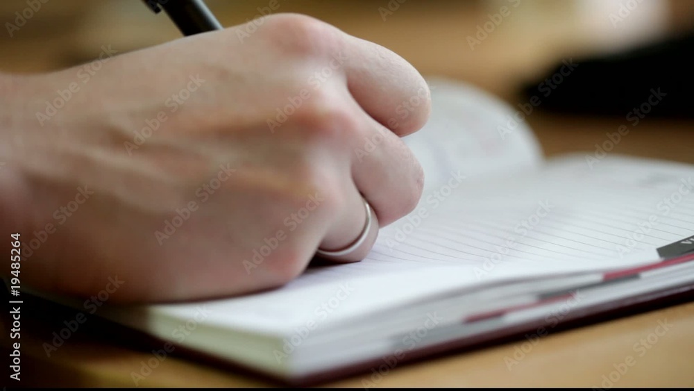 Writing in notebook Writing in notebook