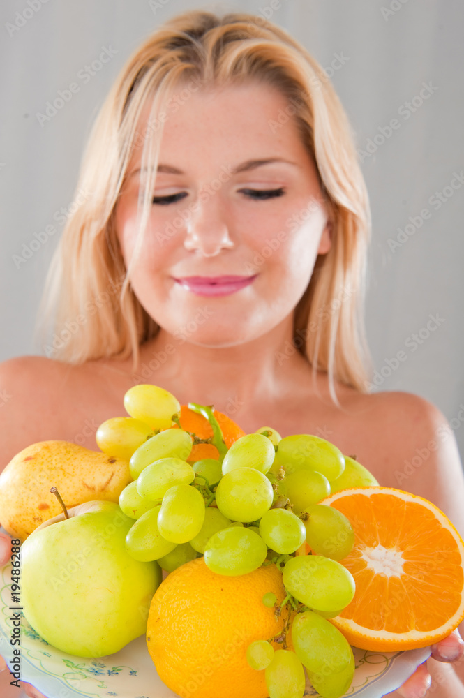 Young healthy woman with pure skin and fruits Young healthy woman with pure skin and fruits