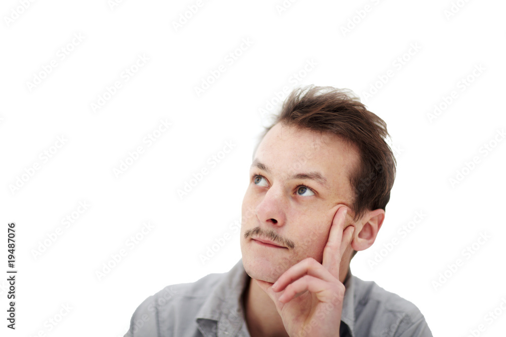 Thinking - Handsome young man looking up at copyspace Thinking - Handsome young man looking up at copyspace