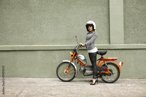 Sexy woman on a moped.