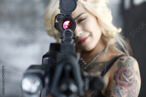 Sexy woman with assault rifle.