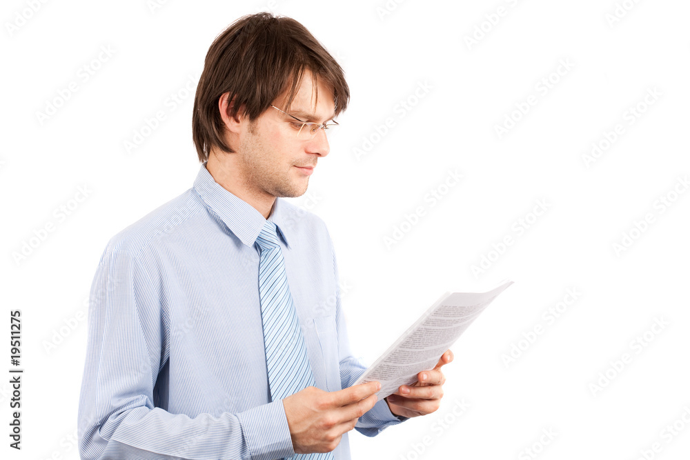Young businessman reading a report Young businessman reading a report