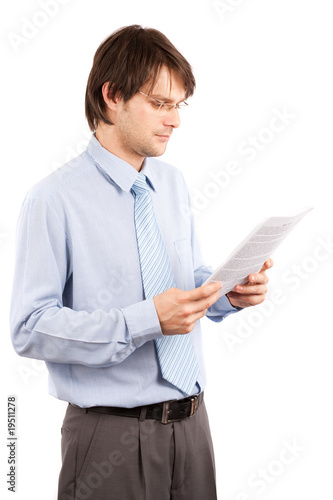 Young businessman reading a report