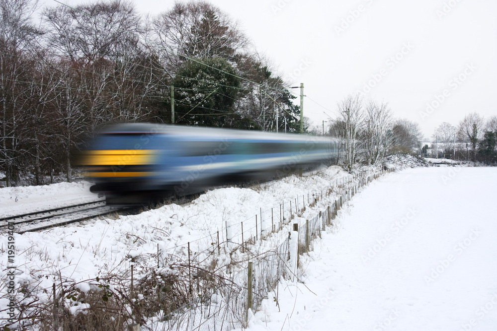 Naklejka premium train running in the snow