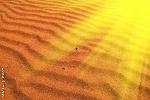 red sand in a rays of sun © Yuriy Kulik