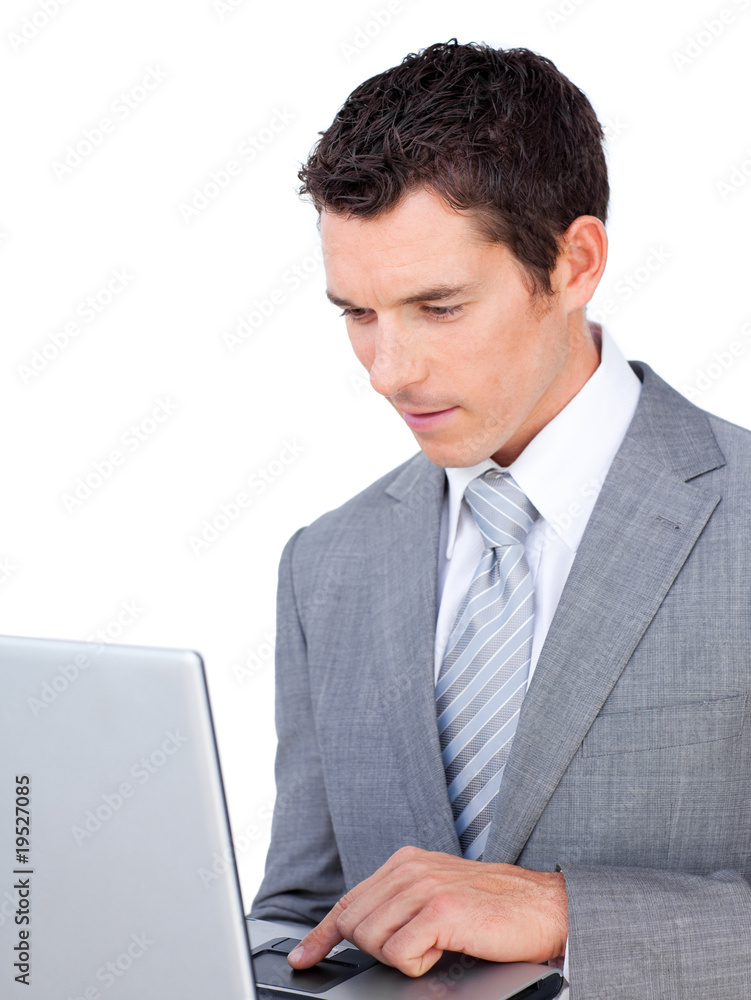 Caucasian businessman using a laptop Caucasian businessman using a laptop