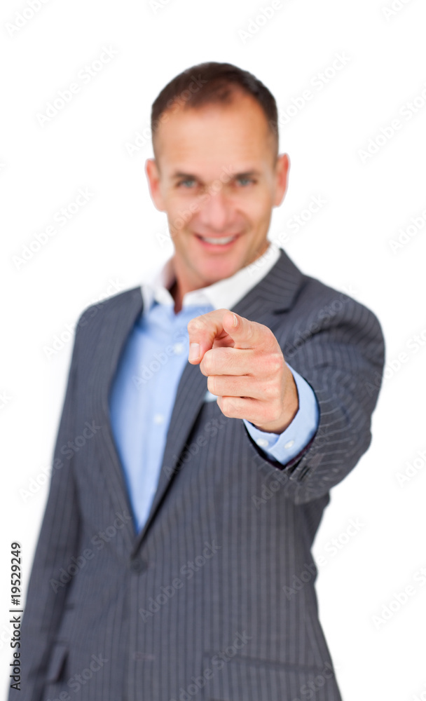 Charismatic businessman pointing at the camera Charismatic businessman pointing at the camera