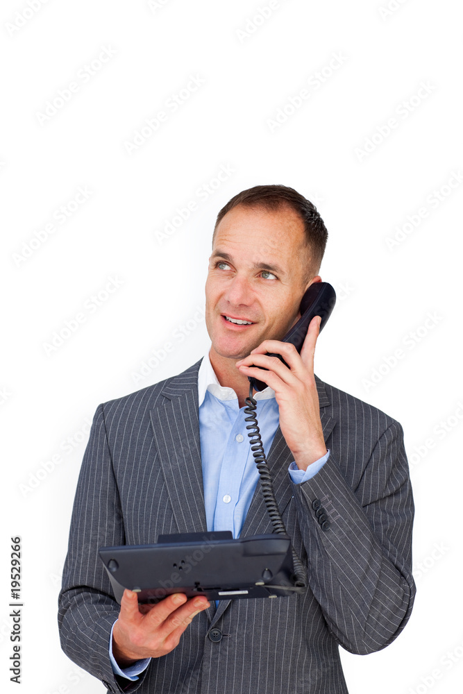 Positive businessman talking on a phone Positive businessman talking on a phone