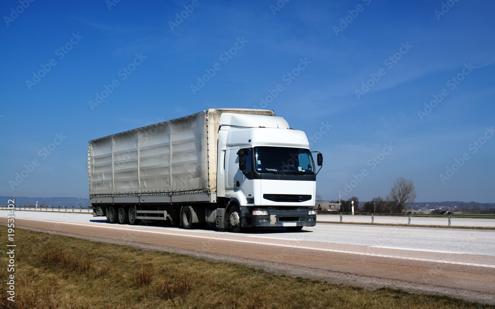 White truck, blue sky. White truck, blue sky.