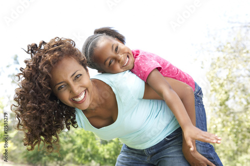 Portrait of Happy Mother and Daughter In Park