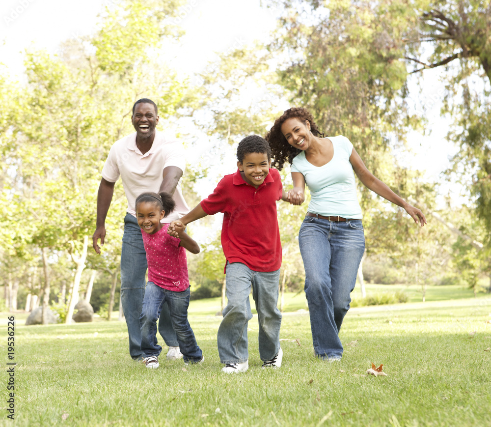 Family Enjoying Walk In Park Family Enjoying Walk In Park