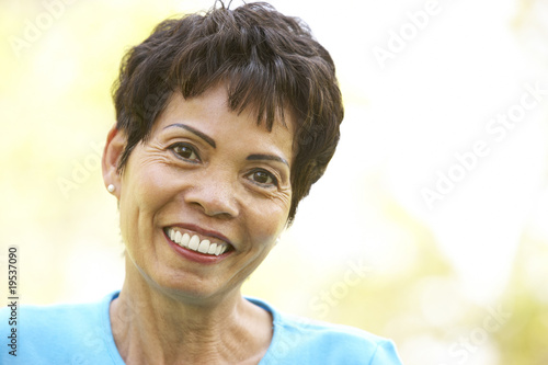 Portrait Of Smiling Senior Woman Outdoors