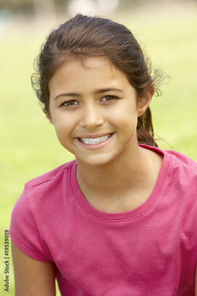 Portrait Of Young Girl Sitting In Park Portrait Of Young Girl Sitting In Park
