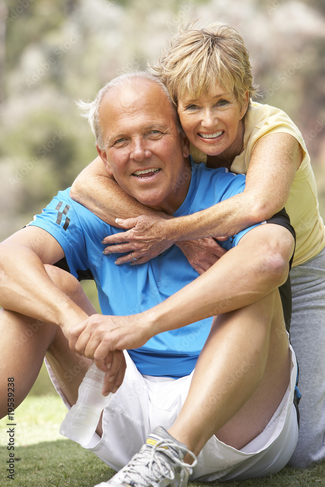 Obraz premium Senior Couple Exercising In Park