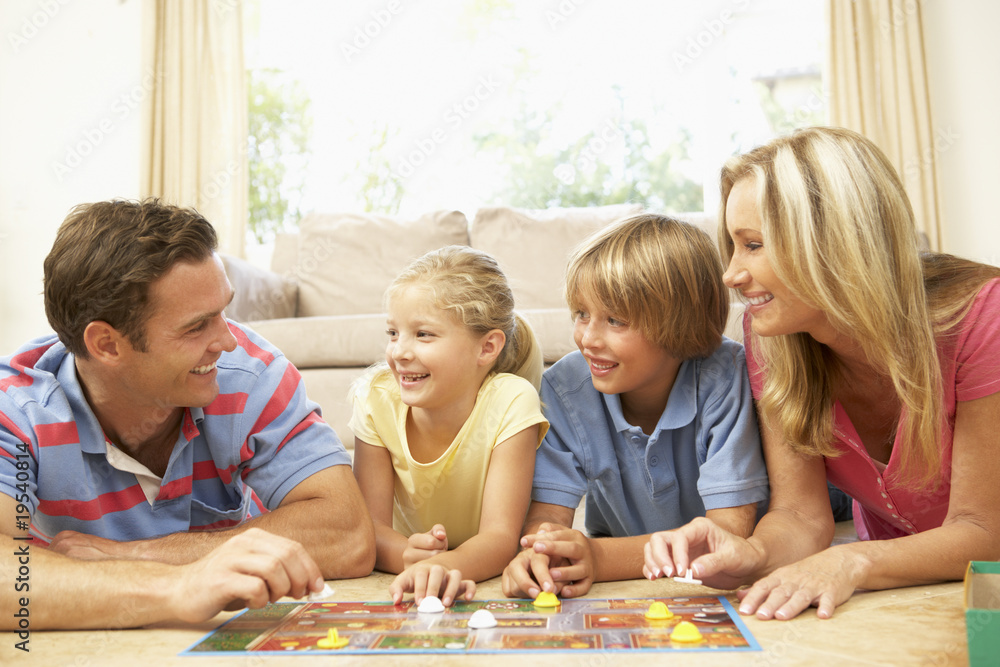 Fototapeta premium Family Playing Board Game At Home