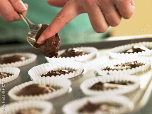 Putting Chocolate Cupcake Mix Into Baking Tin