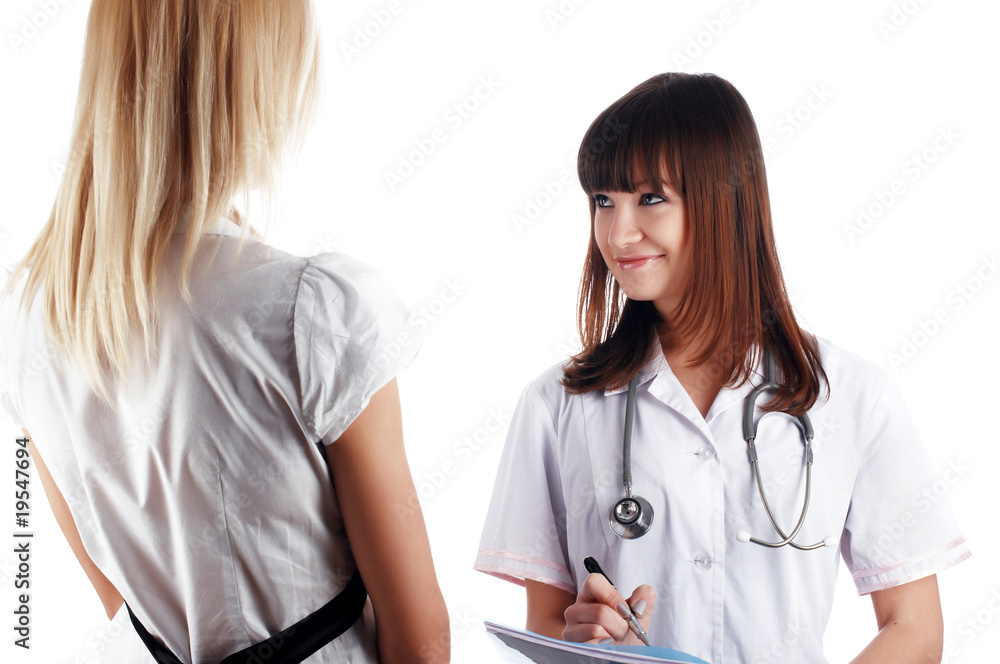 The young charming staff nurse with patient The young charming staff nurse with patient
