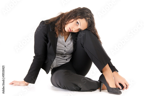 pensive business woman siiting on floor