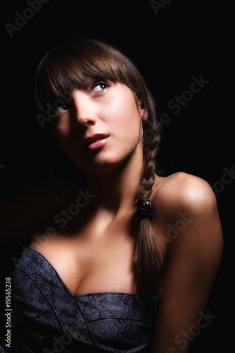 young woman on black background.