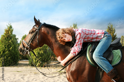 Smiling girl on her horse