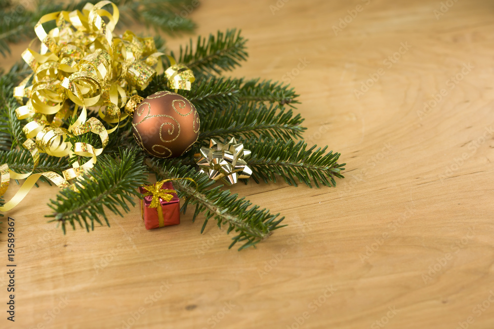 fir branch with ornaments on woodgrain fir branch with ornaments on woodgrain