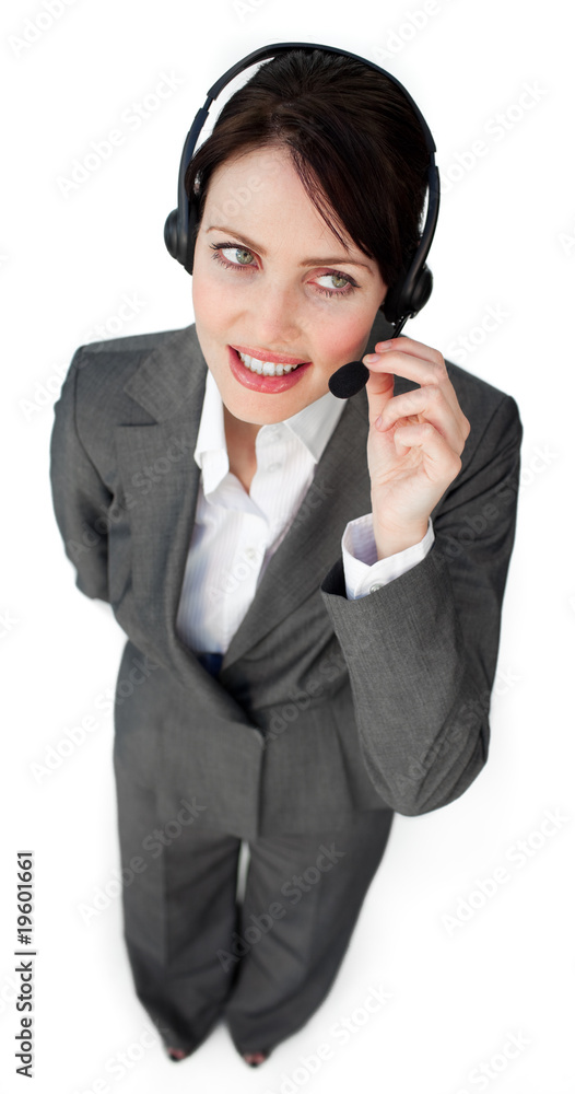 Beautiful young businesswoman talking on a headset Beautiful young businesswoman talking on a headset