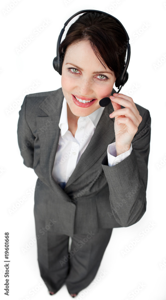 Self-assured businesswoman talking on a headset Self-assured businesswoman talking on a headset