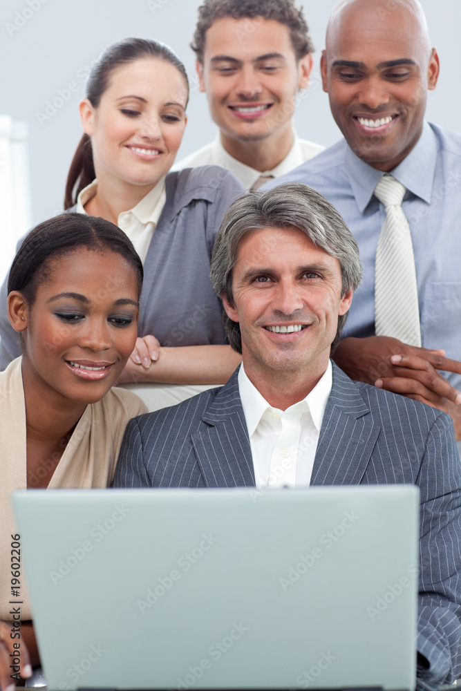 Positive International business people using a laptop Positive International business people using a laptop