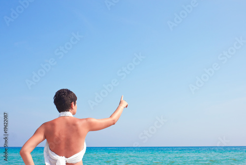 woman pointing to the sea