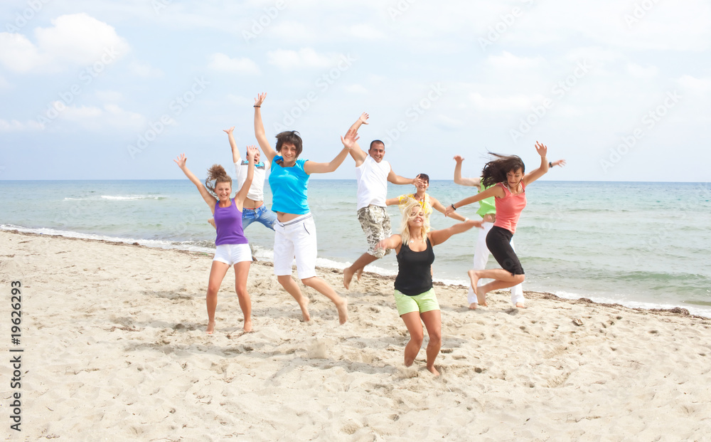 happy crew jumping on the beach happy crew jumping on the beach