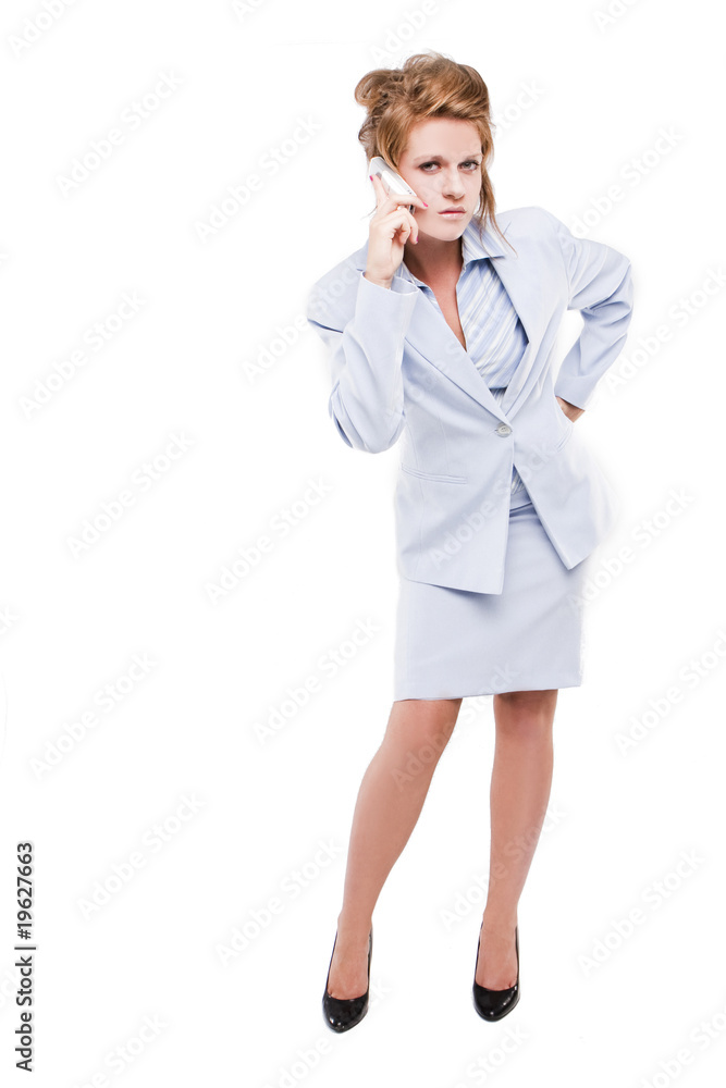 Business woman speaking on her cell phone Business woman speaking on her cell phone