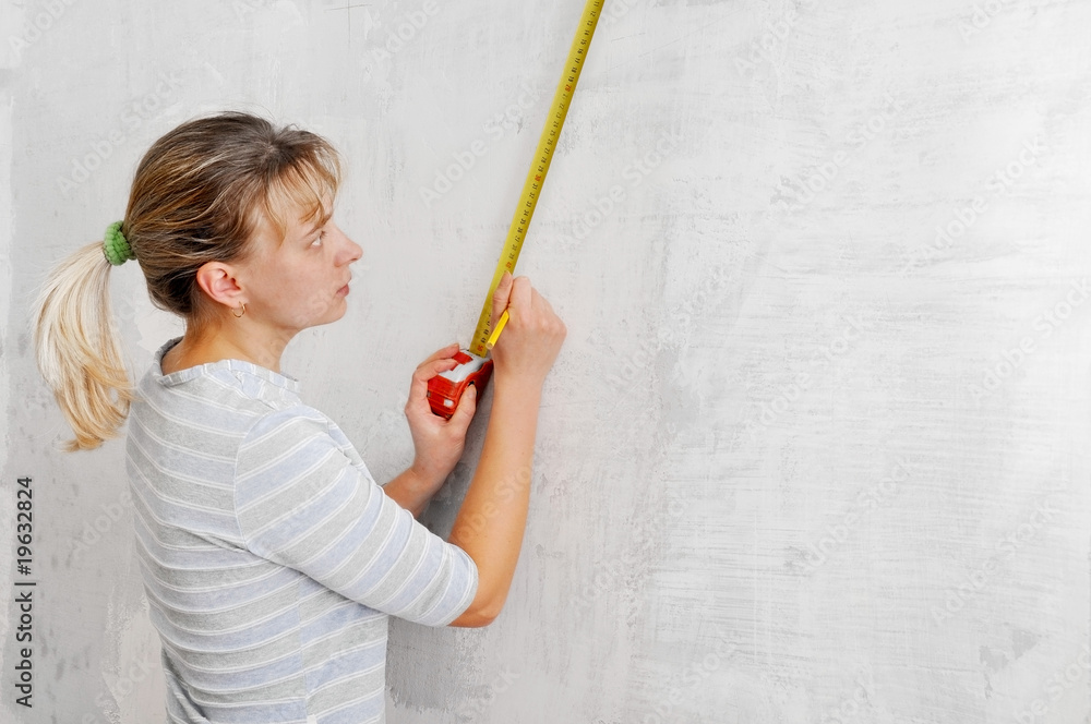 Young blonde with measure in hands