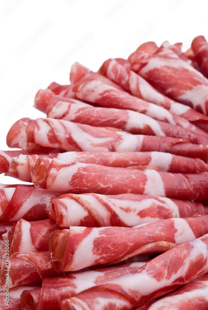 Cutting sausage and cured meat on a celebratory table Cutting sausage and cured meat on a celebratory table