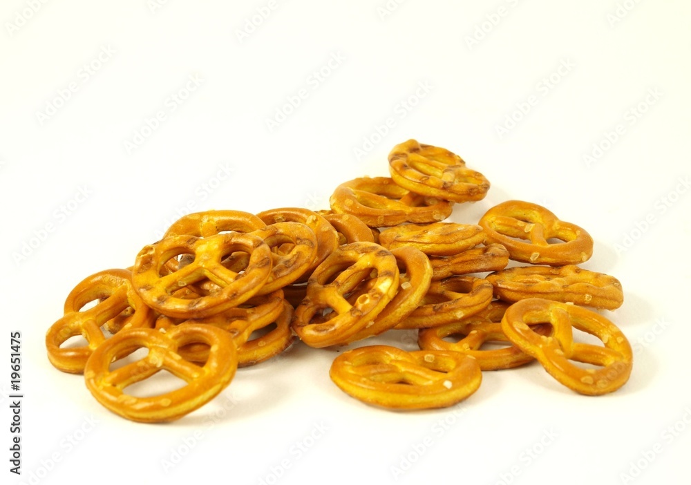 Golden salted pretzel on white background Golden salted pretzel on white background