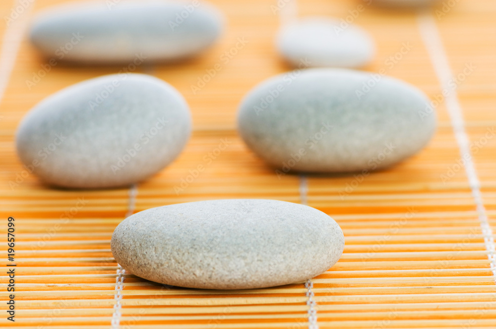 Stack of spa pebbles against blurred background Stack of spa pebbles against blurred background
