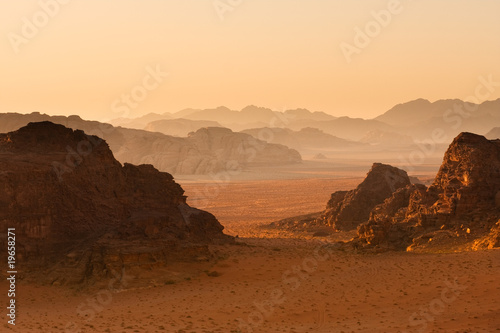 Receding mountains in sunset, Wadi Rum, Jordan. photo