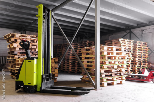 forklifter stacker in warehouse photo