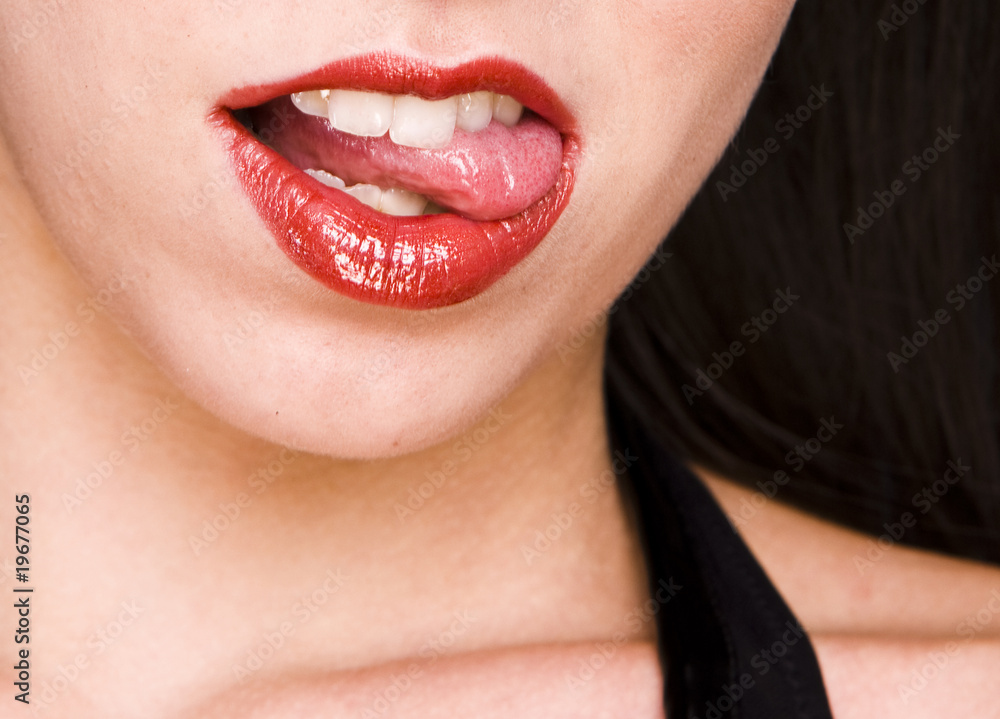 Obraz premium Beautiful woman leaking teeth with tongue