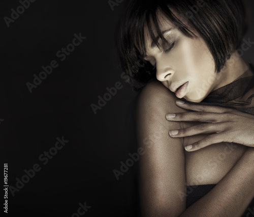 Headshot brunette woman with her eyes closed