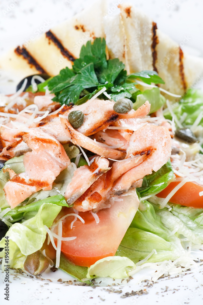 salad with grilled salmon fillet.