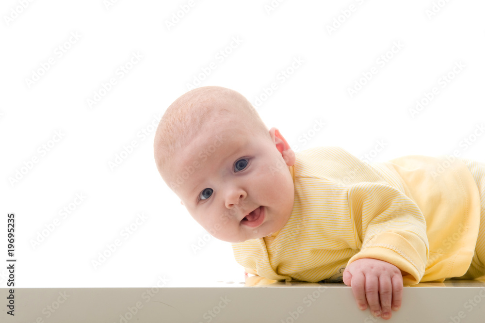 Young baby boy creeps on a table Young baby boy creeps on a table
