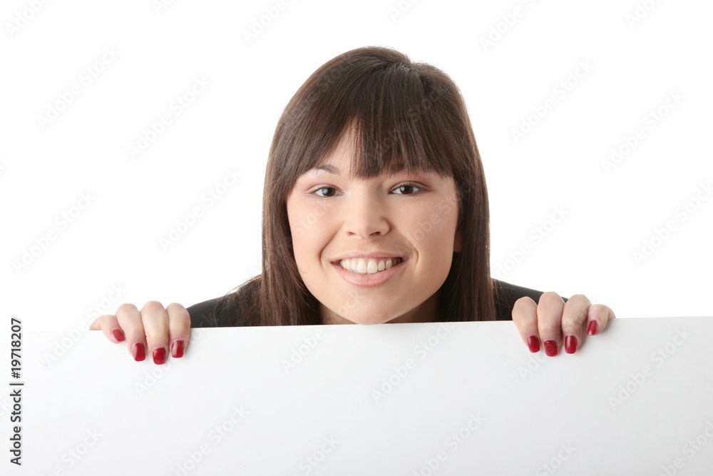 A pretty business woman holding a blank sign A pretty business woman holding a blank sign